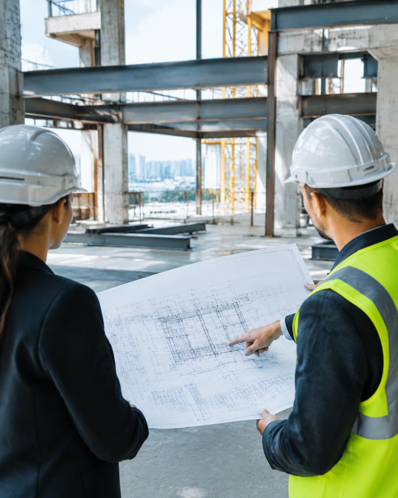 Project team reviewing drawings on site
